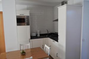 Kuchyň nebo kuchyňský kout v ubytování CASA SOLORGA - apartamentos rurales