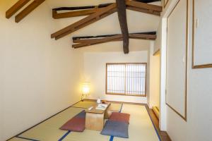 Postel nebo postele na pokoji v ubytování Tsukinowacho House