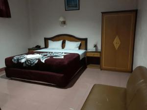 Postel nebo postele na pokoji v ubytování Hotel Parewisata