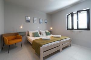 Posteľ alebo postele v izbe v ubytovaní Apartmani Vale