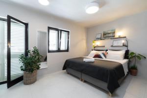 Posteľ alebo postele v izbe v ubytovaní Apartmani Vale