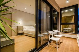 Ein Bett oder Betten in einem Zimmer der Unterkunft Rea Boutique Hotel