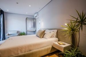 Ein Bett oder Betten in einem Zimmer der Unterkunft Rea Boutique Hotel