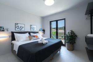 Posteľ alebo postele v izbe v ubytovaní Apartmani Vale