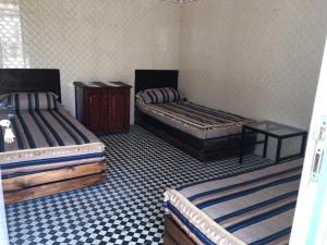 Postel nebo postele na pokoji v ubytování Youth Hostel International Fez
