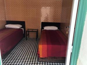 Postel nebo postele na pokoji v ubytování Youth Hostel International Fez