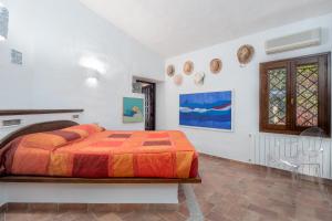 Tempat tidur dalam kamar di Corbezzoli