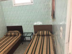 Postel nebo postele na pokoji v ubytování Youth Hostel International Fez