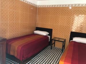 Postel nebo postele na pokoji v ubytování Youth Hostel International Fez + 30 fotografií