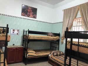 Postel nebo postele na pokoji v ubytování Youth Hostel International Fez