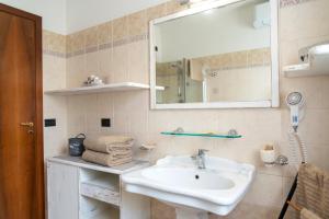 a bathroom with a sink and a mirror at Villa Alida Casa Vacanze in Foligno +52 photos