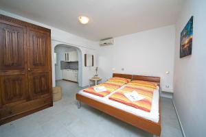 Postel nebo postele na pokoji v ubytování Adria Brela Apartments