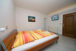 Postel nebo postele na pokoji v ubytování Adria Brela Apartments