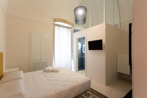 A bed or beds in a room at Viasarnelli72