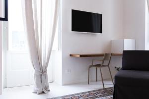 TV a/nebo společenská místnost v ubytování Viasarnelli72 + 19 fotografií