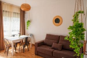 a living room with a couch and a table at LAS CASITAS DEL VERDEL in Suances