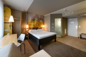 
Ein Bett oder Betten in einem Zimmer der Unterkunft ibis Luebeck City
