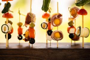 a group of vegetables hanging on wooden sticks at ODELYA - Stadthotel im Park in Basel
