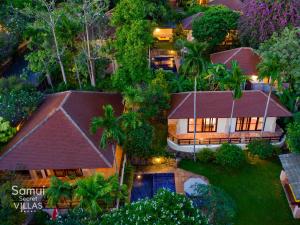 an aerial view of a home at night at Samui Secret Villas in Choeng Mon Beach