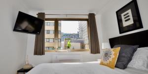Llit o llits en una habitació de Marlyn Lodge – City of London
