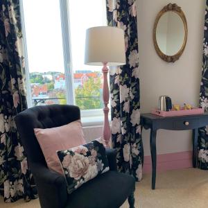 a room with a chair and a lamp and a window at Bucciali in Boulogne-sur-Mer +13 photos