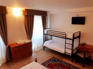 Postel nebo postele na pokoji v ubytování Albergo Trieste