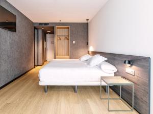 Postel nebo postele na pokoji v ubytování Hotel Forum Ceao