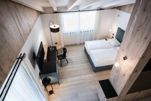 Posteľ alebo postele v izbe v ubytovaní Hotel Ciasa Tamá