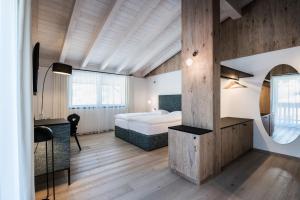 Posteľ alebo postele v izbe v ubytovaní Hotel Ciasa Tamá