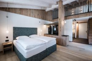 Posteľ alebo postele v izbe v ubytovaní Hotel Ciasa Tamá
