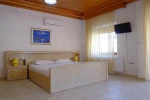 A bed or beds in a room at Villa Aleka