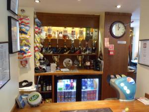 a shop with a clock on the wall and a counter at The Shoes in Durham