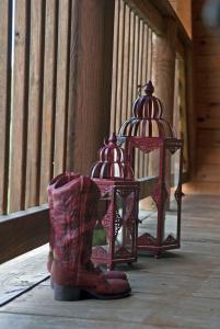 a pair of boots next to a bird cage at Shirley's Bed And Breakfast in Roanoke