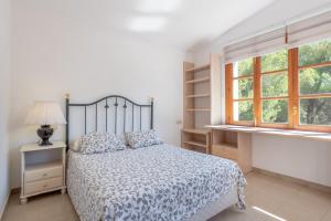 Postel nebo postele na pokoji v ubytování Villa Costa De Blanes