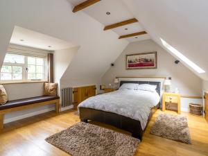 En eller flere senge i et værelse på Souters Cottage Annexe