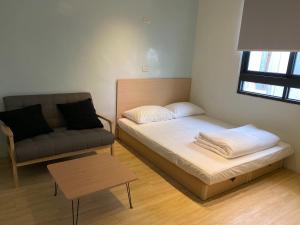 Krevet ili kreveti u jedinici u okviru objekta Donghai Cottage Backpack Inn Suite