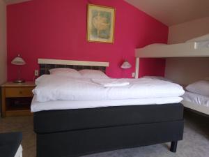 Postel nebo postele na pokoji v ubytování Hotell Milano + 4 fotografie