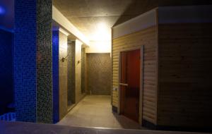 a hallway of a bathroom with a wooden door at Terassa Hotel Kobuleti in Kobuleti +61 photos