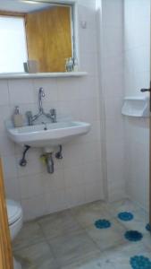 a bathroom with a sink and a toilet at panormos studio in Panormos