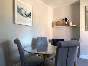 a dining room with a table and chairs at The Croft in Oakham