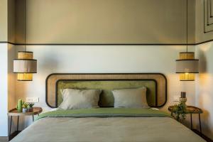 Letto o letti in una camera di Hover Boutique Hotel