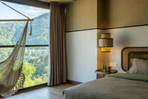 Letto o letti in una camera di Hover Boutique Hotel