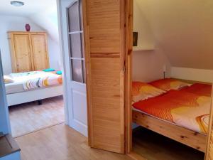Postel nebo postele na pokoji v ubytování Camping & Guest House Pliskovice