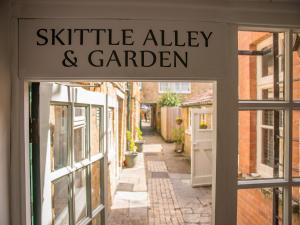 a sign that reads skittle alley and garden outside a building at Phelips Arms in Yeovil