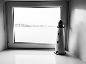 a bottle sitting in front of a window at Pier 36 in Donaghadee