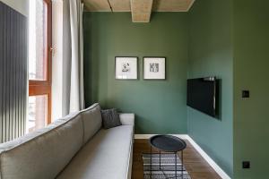 Televízia a/alebo spoločenská miestnosť v ubytovaní Homewell Boutique Apartments Stare Miasto