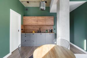 Kuchyňa alebo kuchynka v ubytovaní Homewell Boutique Apartments Stare Miasto