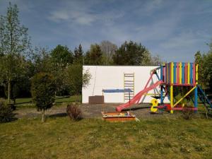 a playground with a slide and a play structure at Camping & Guest House Pliskovice in Mirovice