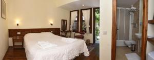 A bed or beds in a room at Villa Konak Hotel Még 37 kép