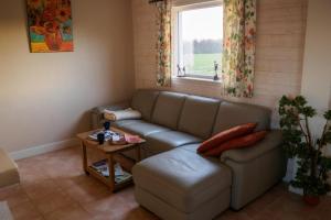 Posezení v ubytování Vakantiewoning De Wilg - rustig gelegen